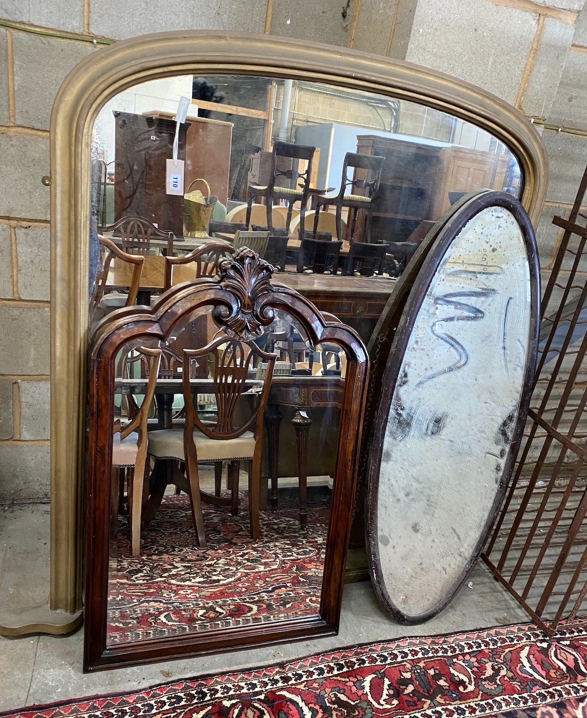 A Victorian giltwood overmantel mirror, width 150cm, height 150cm together with two later wall mirrors